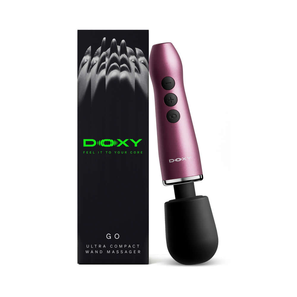Doxy Go Travel-sized Wand Massager Pink displayed with packaging, featuring a sleek design and travel-friendly size.