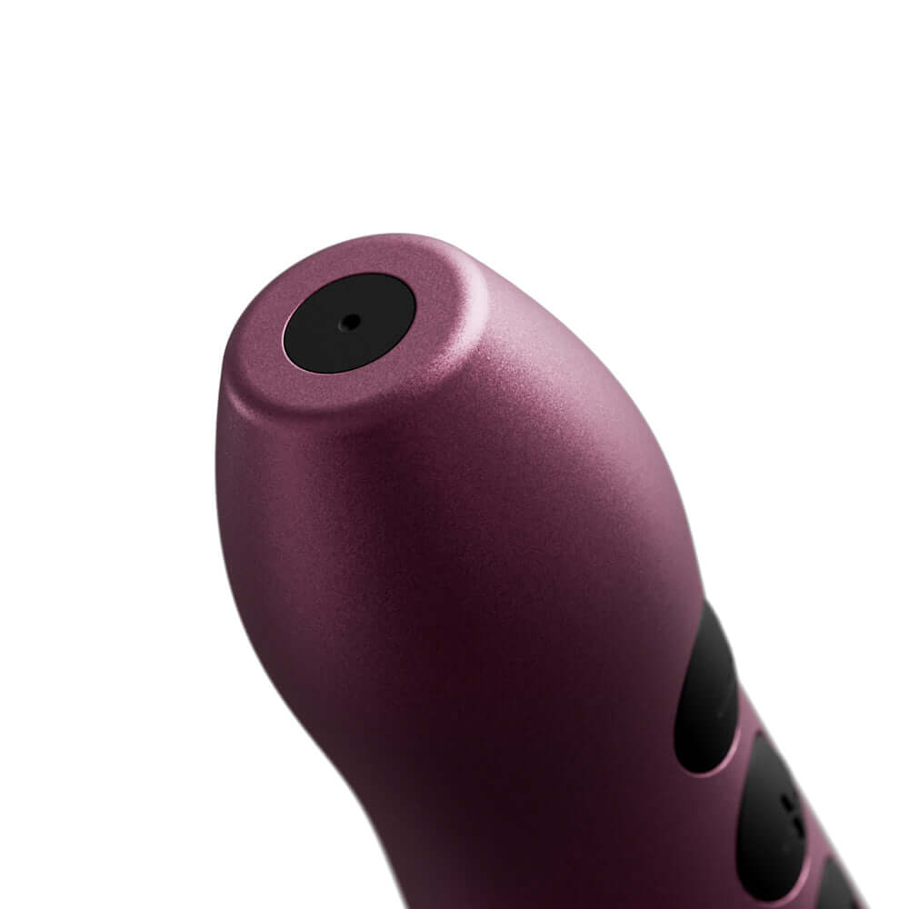 Close-up of the Doxy Go Travel-sized Wand Massager Pink, showcasing its sleek anodized aluminum design.