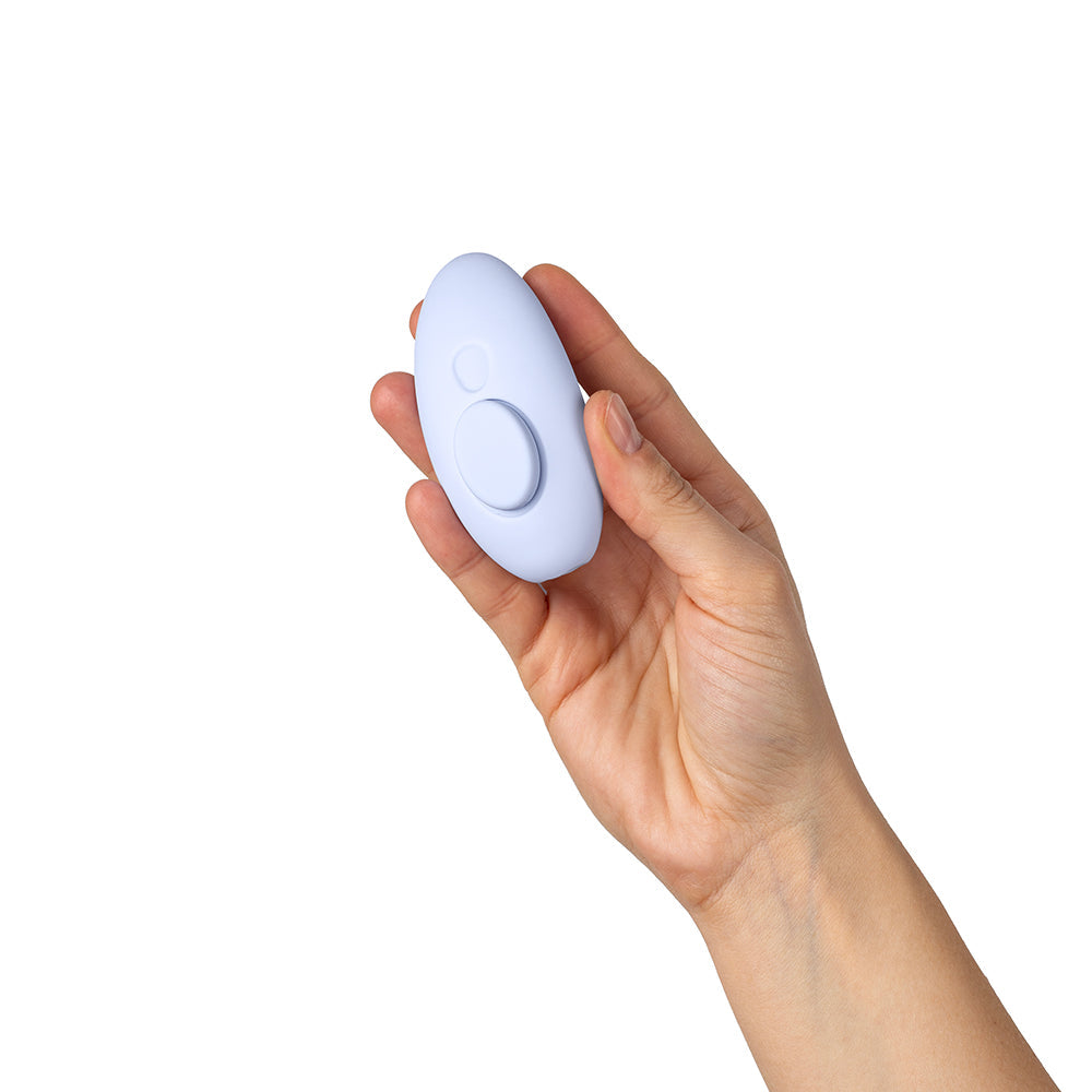 Dame Lay Panty Vibrator With Remote Control held in a hand showcasing its ergonomic design.