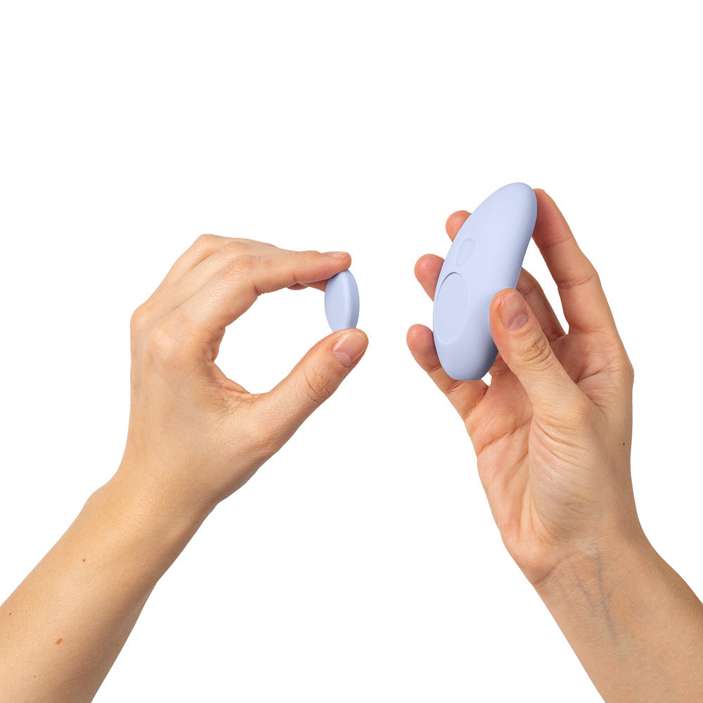 Dame Lay Panty Vibrator With Remote Control held in hands showing sizes and ergonomic design.
