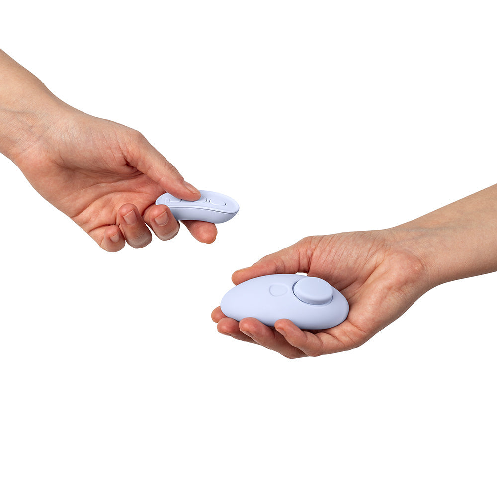 Dame Lay Panty Vibrator With Remote Control being held in hands for convenient activation.