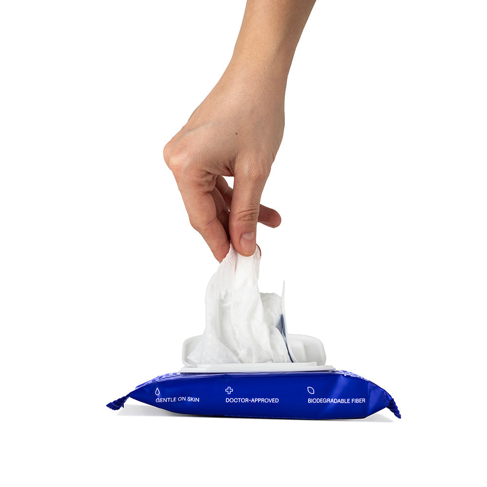 Dame Body Wipes 12 count Aloe & Cucumber being pulled from a pack, showcasing gentle and refreshing cleansing.