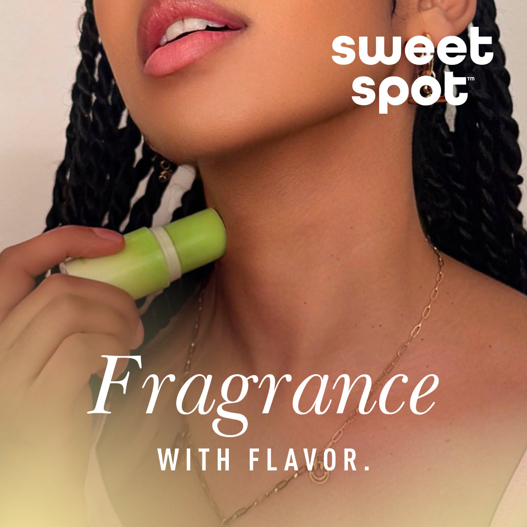 Sweetums Sweet Spot Fragrance Pineapple Coconut Crush stick being applied on the neck, showcasing tropical scent and flavor.