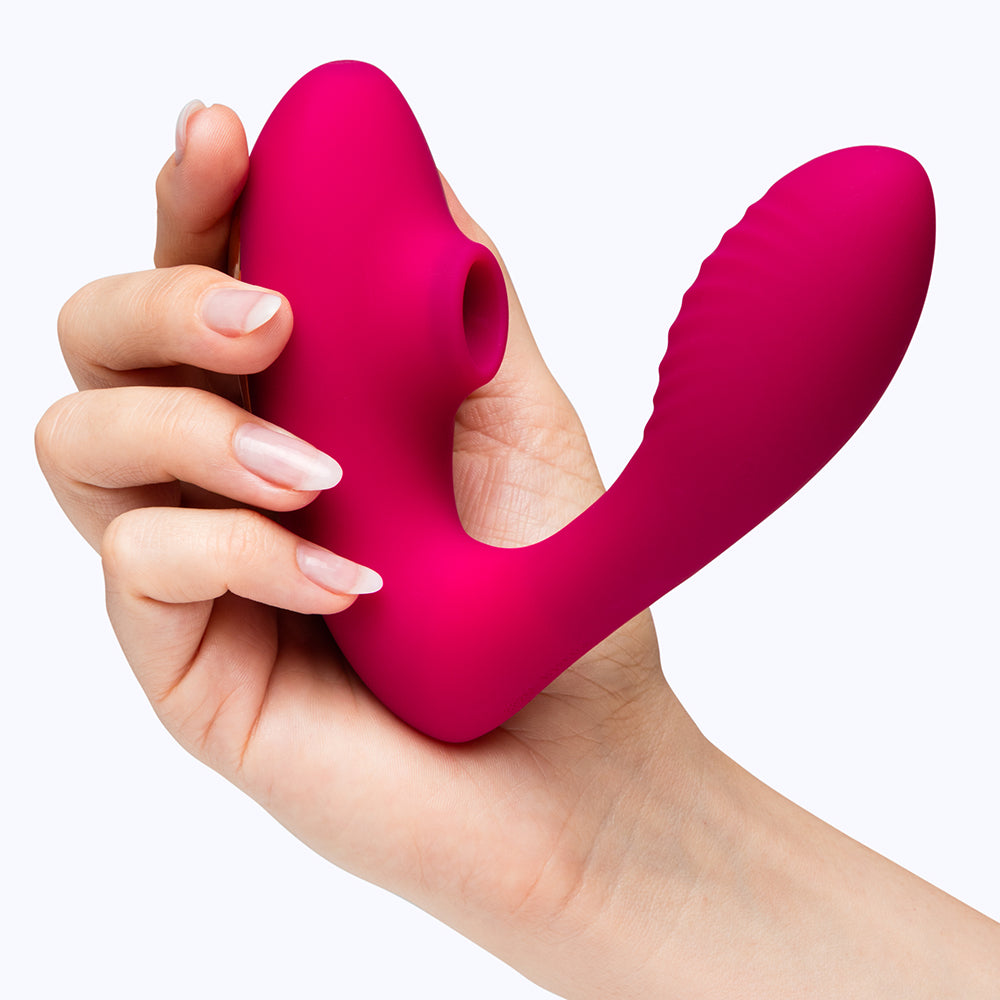 Lovehoney Indulge 12 Day Advent Calendar 2026 held in a hand, showcasing its vibrant design for intimate surprises.