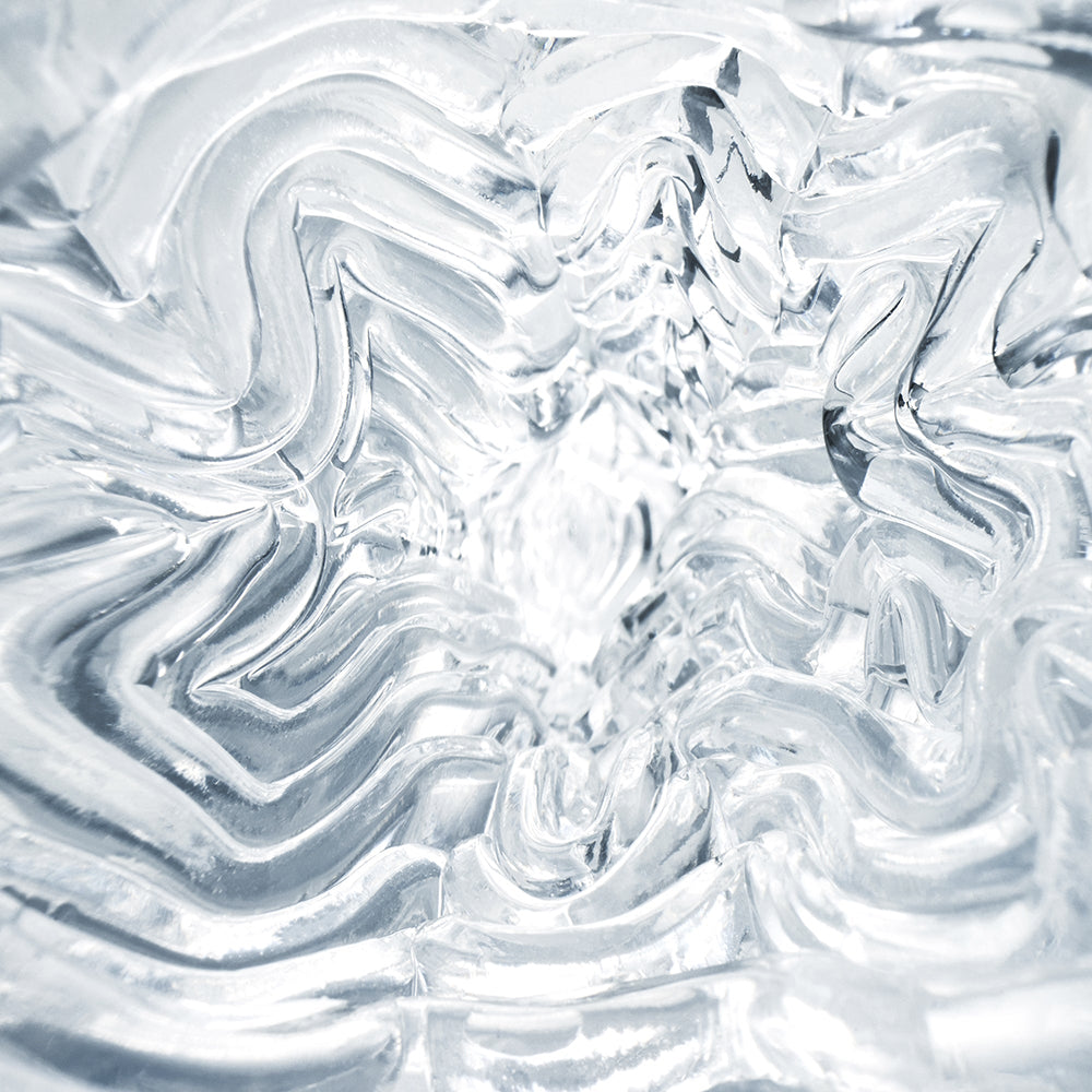 Close-up view of the textured interior of the Tenga Geo Aqua Masturbator Sleeve showcasing its unique wave pattern.