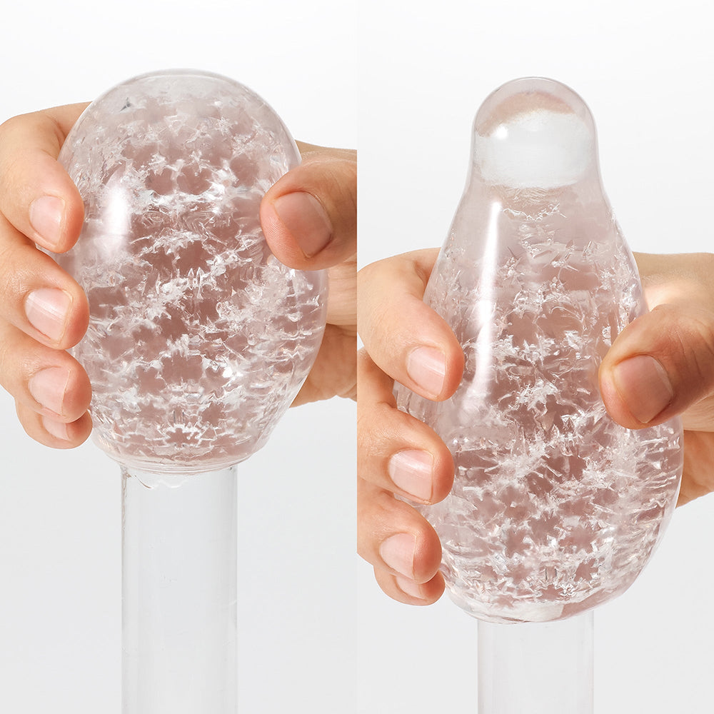 Tenga Geo Aqua Masturbator Sleeve in hands, showcasing unique texture and design for enhanced stimulation.