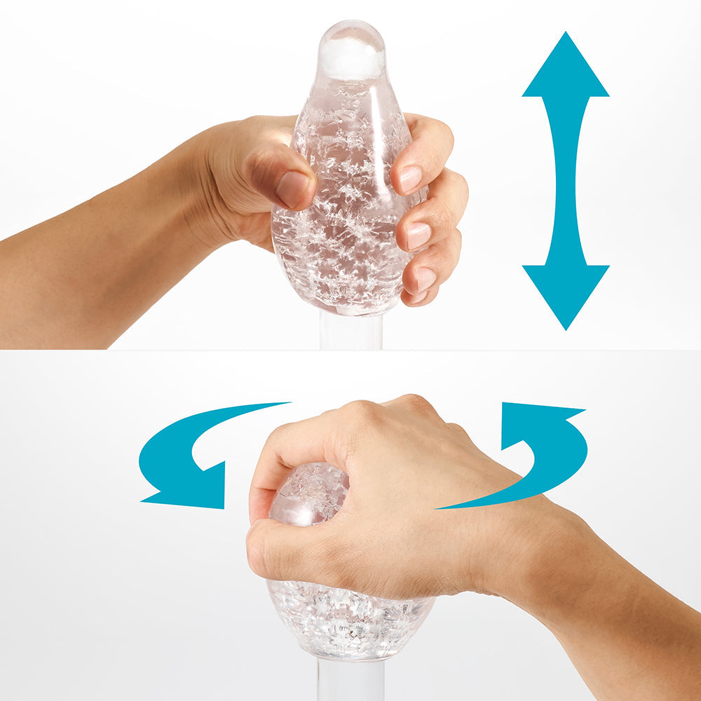 User demonstrating the Tenga Geo Aqua Masturbator Sleeve with squeezing and rotating motions for textured experience.