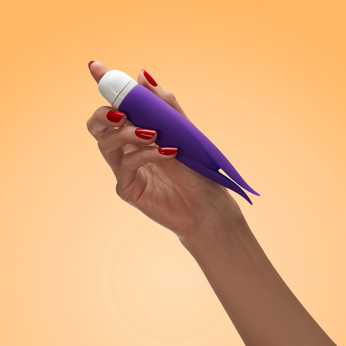 Hand holding Fun Factory Volita Vibrator Violet against an orange background, showcasing its sleek design.