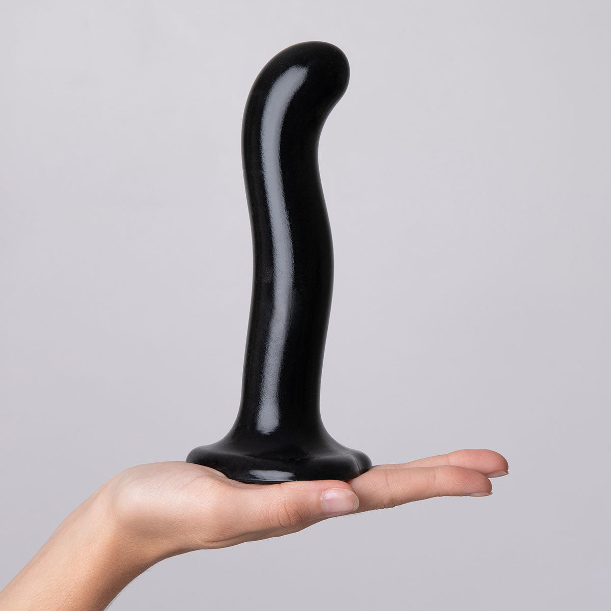 Strap-On-Me P&G Spot Dildo Small Black held in hand showcasing its ergonomic design and contoured shape.