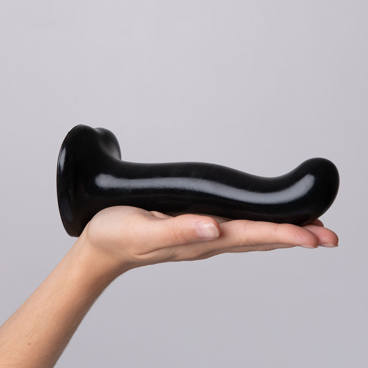 Strap-On-Me P&G Spot Dildo Small Black held in hand, showcasing its ergonomic design for targeted stimulation.