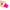 Person holding the Bang Dual Silicone Clitoral Vibrator Pink, showcasing its soft silicone design and vibration feature.