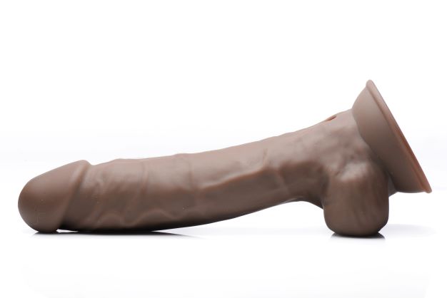 Fleshstixxx 8 Inch Vibrating Dildo With Balls Dark displayed on a white background showcasing its lifelike sculpting.