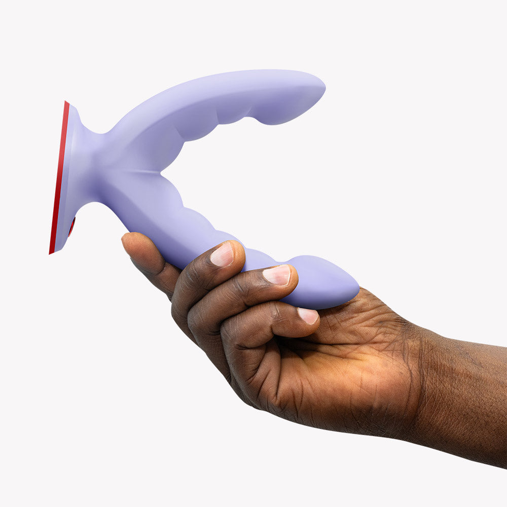 Fun Factory Ryde Grinding Dildo Purple held in hand, showcasing its versatile design and ribbed structure.
