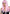Leg Avenue 24 Inch Long Straight Bang Wig Pink showcasing silky pink hair and soft bangs for a stylish look.