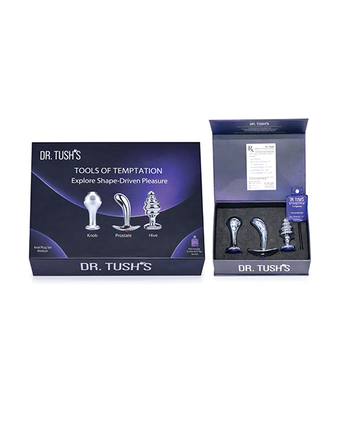 Dr Tush's Tools of Temptation Medium Anal Plug Set Metal displayed in packaging with three different anal plugs.
