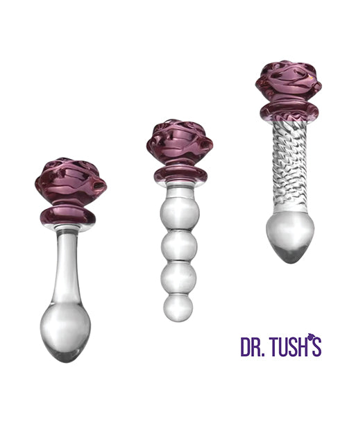 Dr Tush's Sacred Glass Rose Collection Anal Plug Set featuring three elegant hand-blown glass pieces with rose tops.