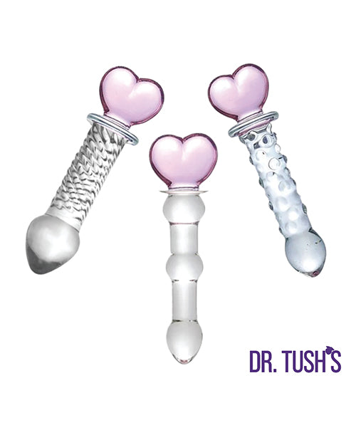 Dr Tush's Hearts of Pleasure Glass Anal Plug Set featuring three heart-topped glass anal plugs in pink and clear designs.