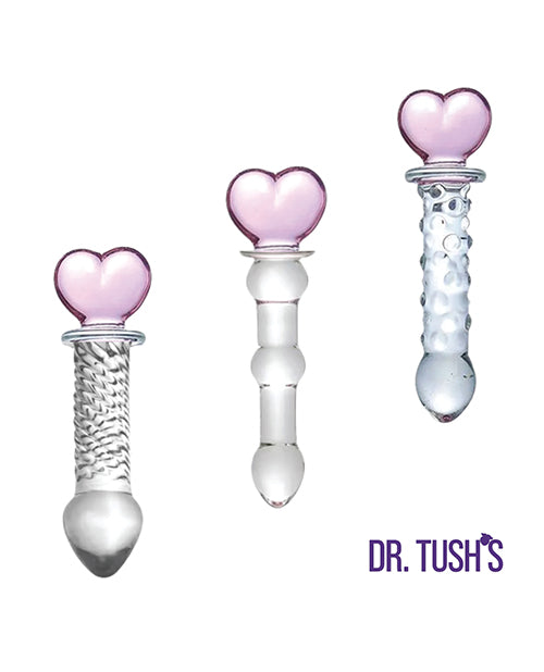 Dr Tush's Hearts of Pleasure Glass Anal Plug Set featuring three elegant glass plugs with pink heart tops.