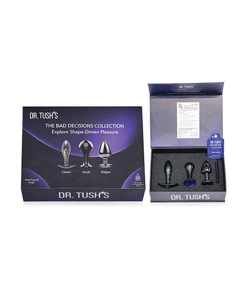 Dr Tush's Bad Decisions Collection Anal Plug Set Metal displayed in its packaging with three unique shapes.