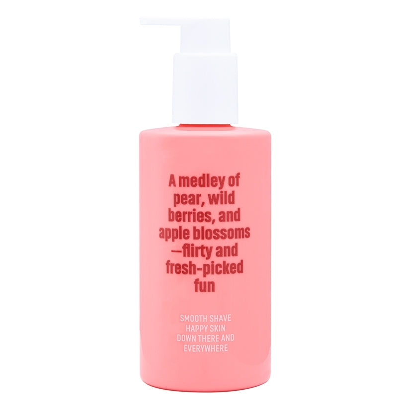 Coochy Shave Cream Pear Berry 8 Oz in a pink bottle with text about pear, berries, and apple blossoms fragrance.