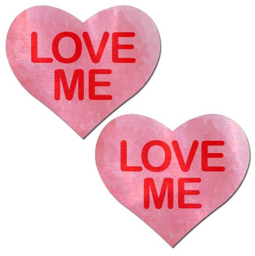 Pastease Liquid Pink Heart Love Me Nipple Pasties in glossy pink heart design with red text.