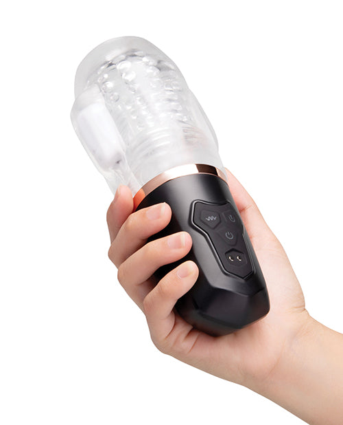 He-Vibe Vibrating Suck Master Suction Masturbator held in hand, showcasing its compact design and controls.