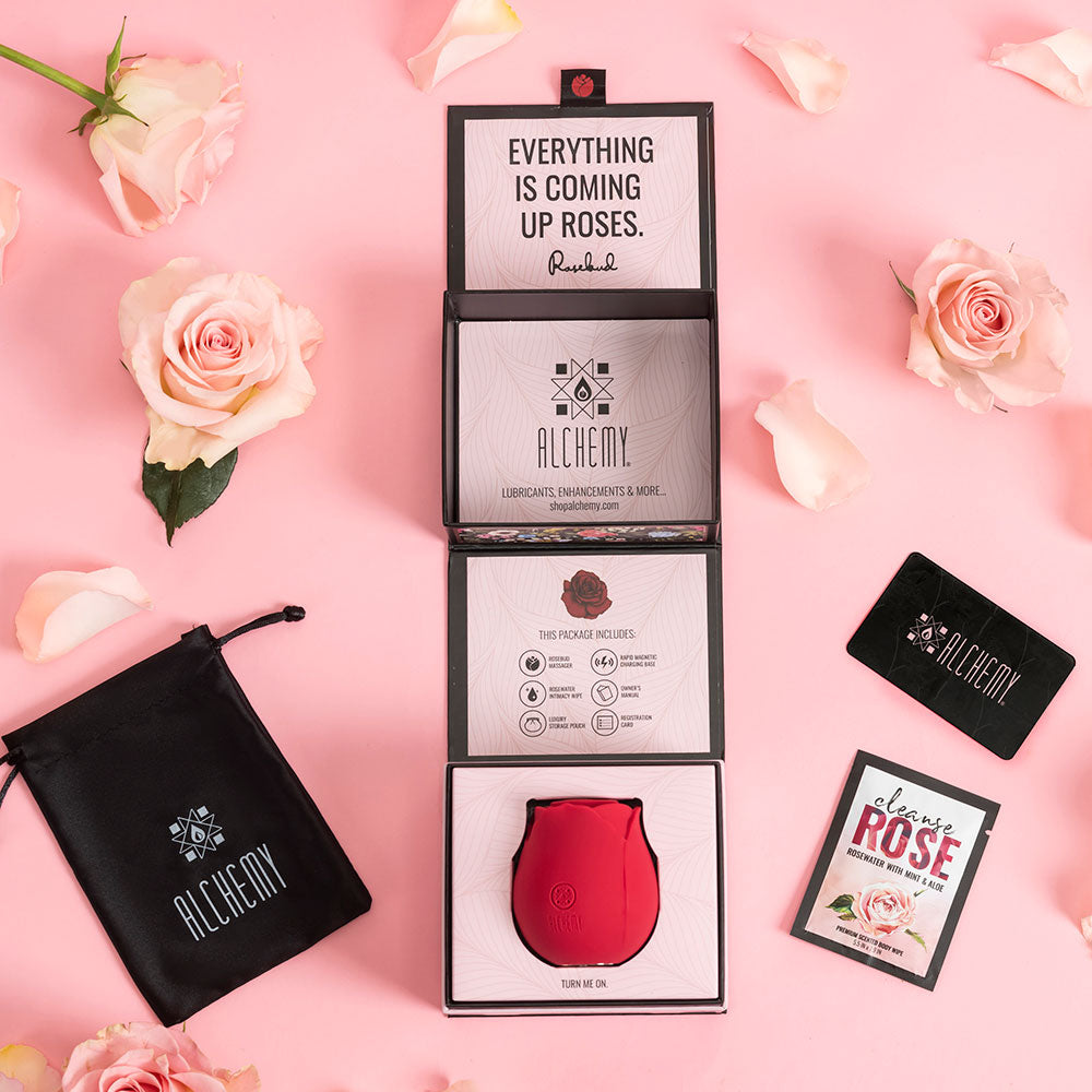 Alchemy Rosebud Luxury Air-Pulse Massager Red in an elegant packaging with rose accents and informative card.