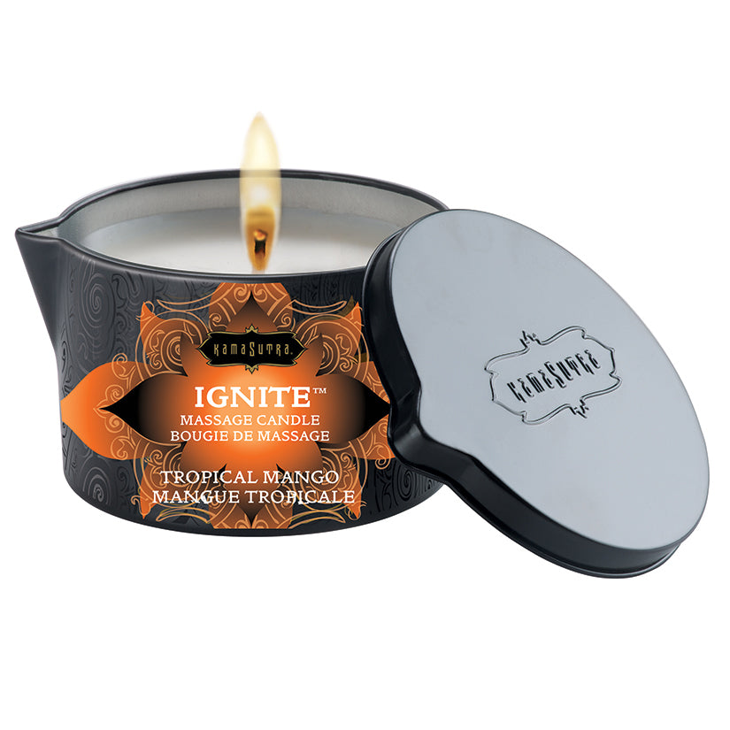 Kama Sutra Ignite Massage Candle Tropical Mango 6 Oz with lid off, showing flame and label design.
