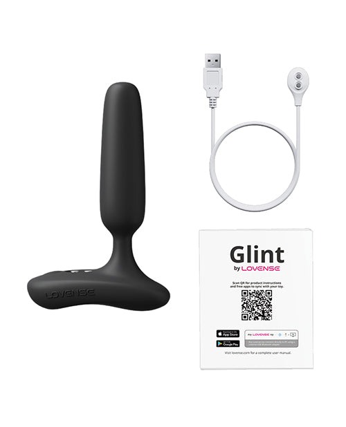 Lovense Glint Touch Responsive Vibrating Butt Plug Black with USB charging cable and instruction manual.