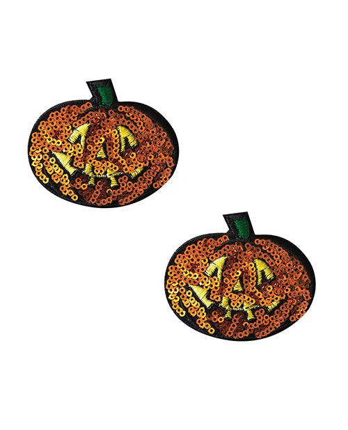 Neva Nude Pumpkin Sequin Pasties Orange in the shape of jack-o'-lanterns with shimmering orange sequins.