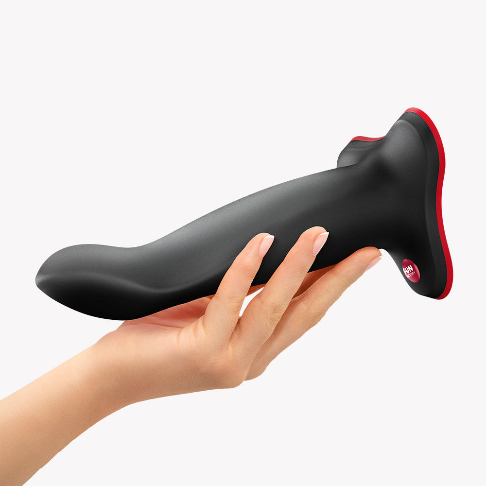 Fun Factory Limba Flex L Bendable Dildo Black held in hand, showcasing its flexible design for targeted pleasure.