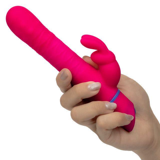 Love Bunny Beaded Spin Bunny Dual Motor Vibrator Pink held in hand, showcasing its vibrant design and features.