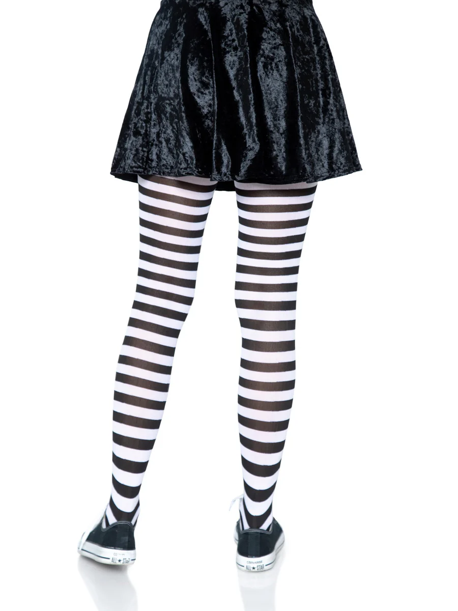 Leg Avenue Jada Nylon Striped Tights Black and White worn with a black skirt and sneakers, showcasing bold stripes.