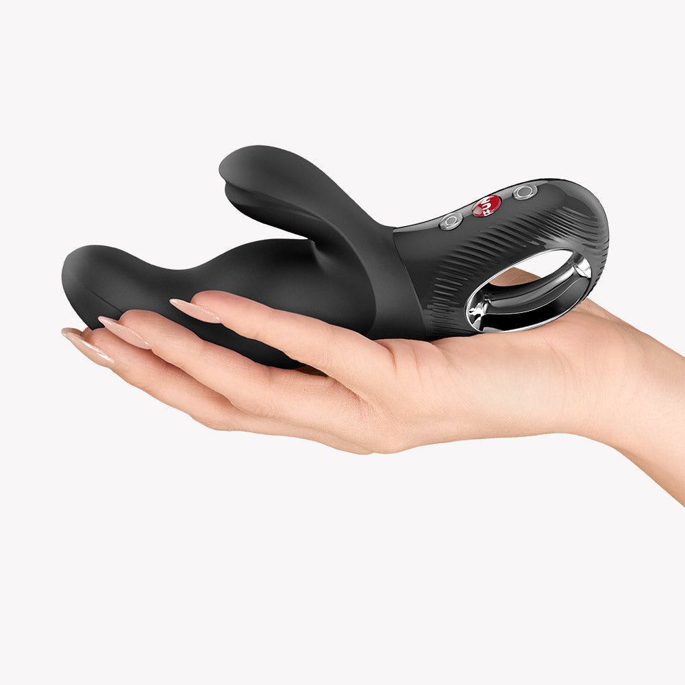Fun Factory Miss Bi Rabbit Vibrator Black held in hand, showcasing its ergonomic design and dual motors.