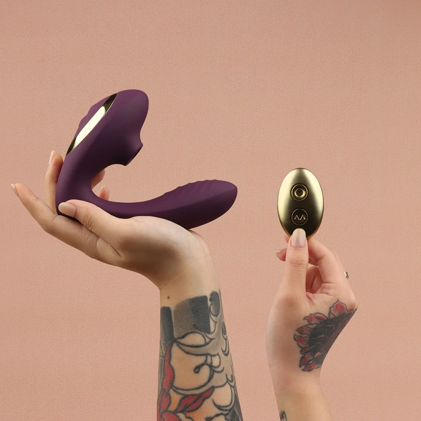 Tracy's Dog OG2 Clitoral Sucking Vibrator Purple with wireless remote, showcasing design and features.