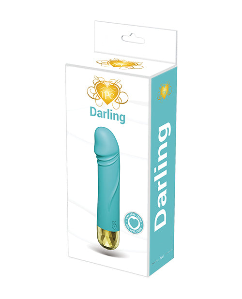 The Pleasure Company Darling Bullet Vibrator Turquoise in packaging, showcasing its compact design and vibrant color.