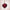 Elegant red heart-shaped pendant on a gold chain, highlighting exquisite design and craftsmanship.