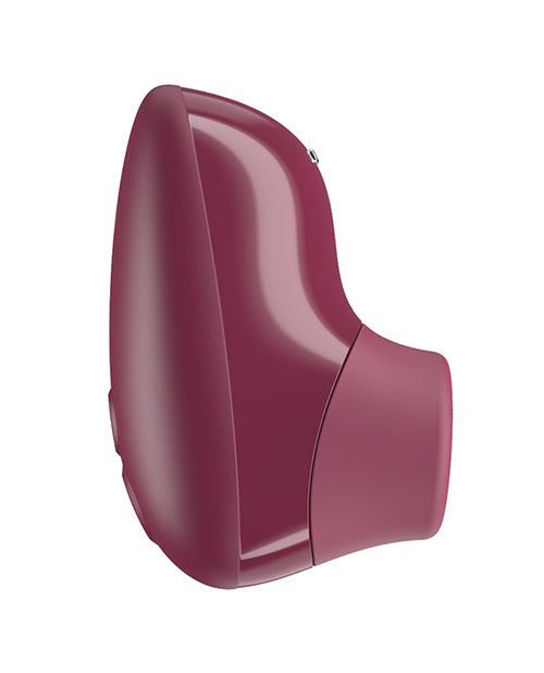 Womanizer Snap Clitoral Stimulator Crushed Berry side view showcasing its sleek design in vibrant color.
