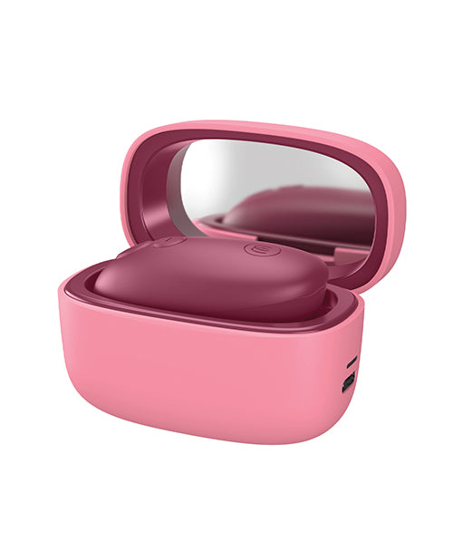 Womanizer Snap Clitoral Stimulator Crushed Berry in a pink case with mirror, showcasing sleek design and portability.