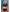 Dreams by Baci Badge of Desire 4 Piece Costume Set Black modeled by a woman in a cropped police uniform and skirt.
