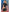 Dreams by Baci Badge of Desire 4 Piece Costume Set Black showcasing a woman in a cropped police uniform from the back.