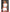 Back view of the model wearing Dreams by Baci Gameday Hottie Cheerleader Set White and Red with pom poms.