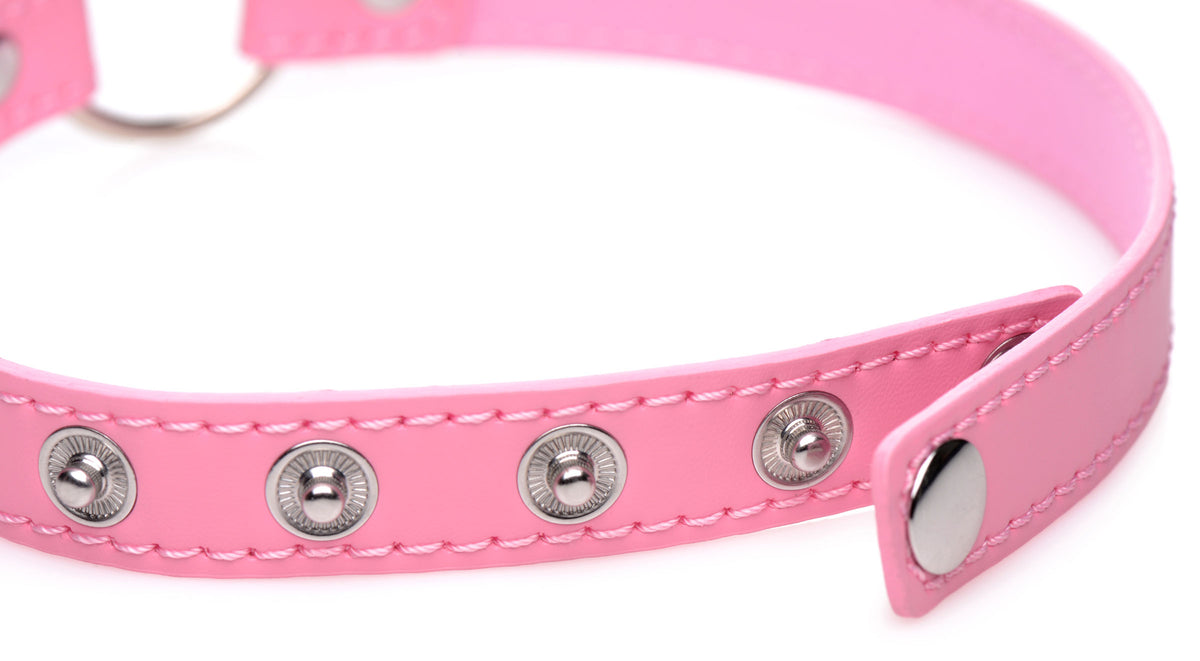 Close-up of Master Series Kinky Kitty Ring Slim Choker Pink with metal snaps and stitching detail.