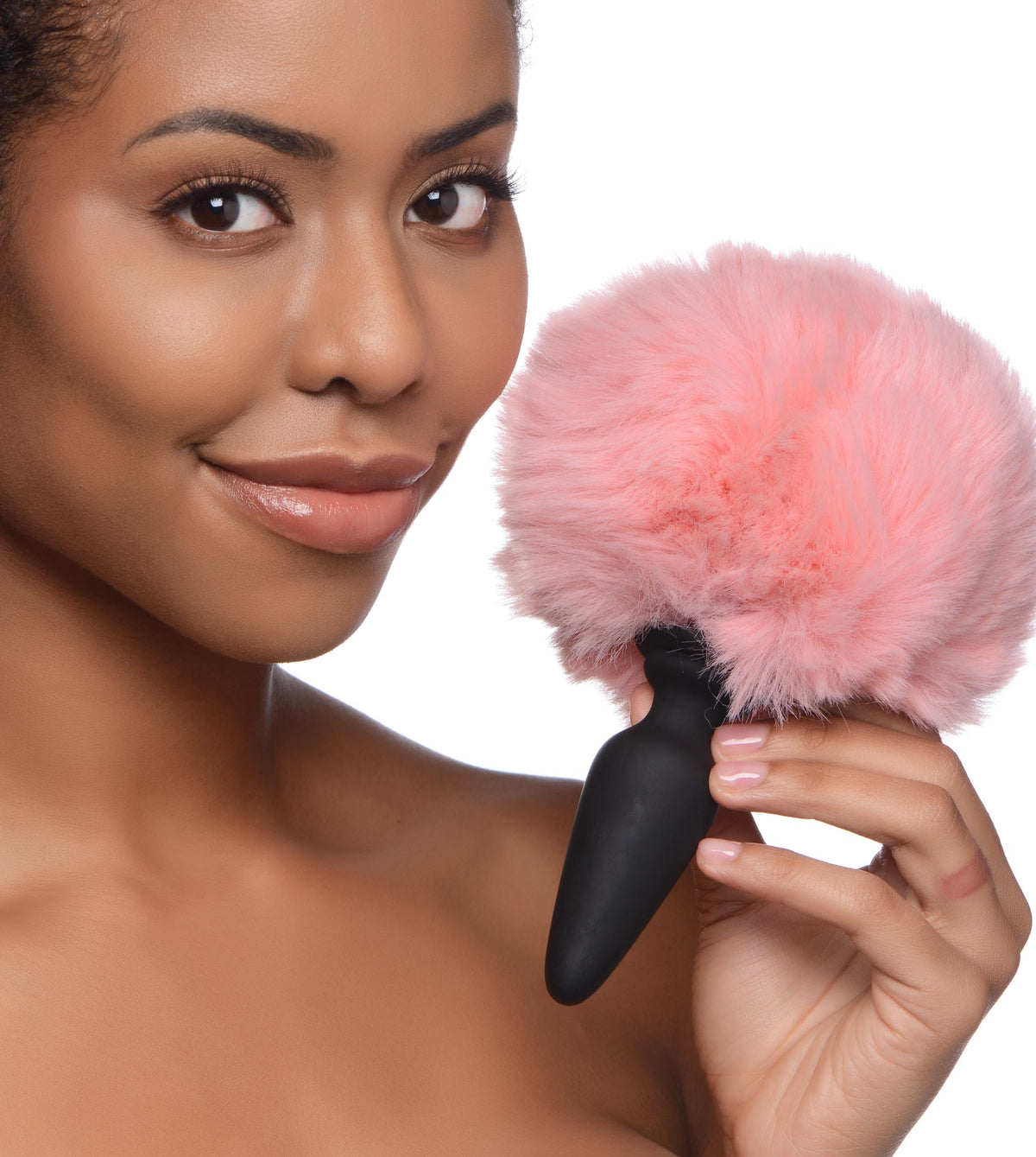 Tailz Silicone Anal Plug with 3 Interchangeable Tails with model holding a pink bunny tail.
