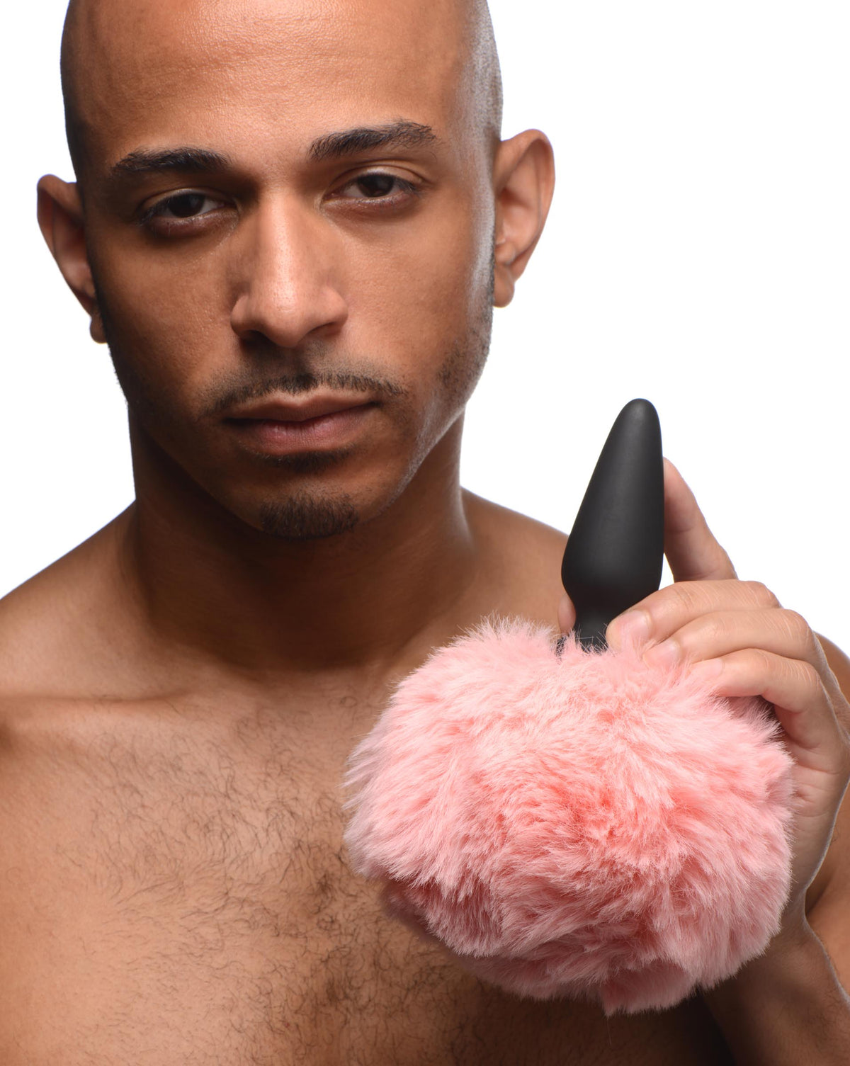Tailz Silicone Anal Plug with 3 Interchangeable Tails held by a man with a pink bunny tail, showcasing playful design.