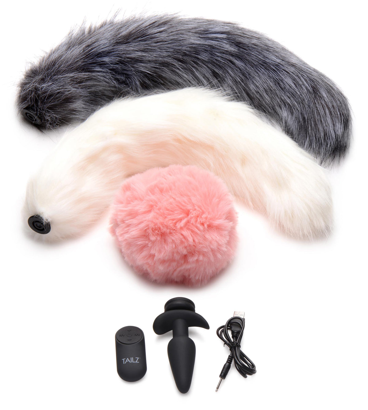 Vibrating Silicone Anal Plug with 3 Interchangeable Tails including gray, white, and pink faux fur tails.
