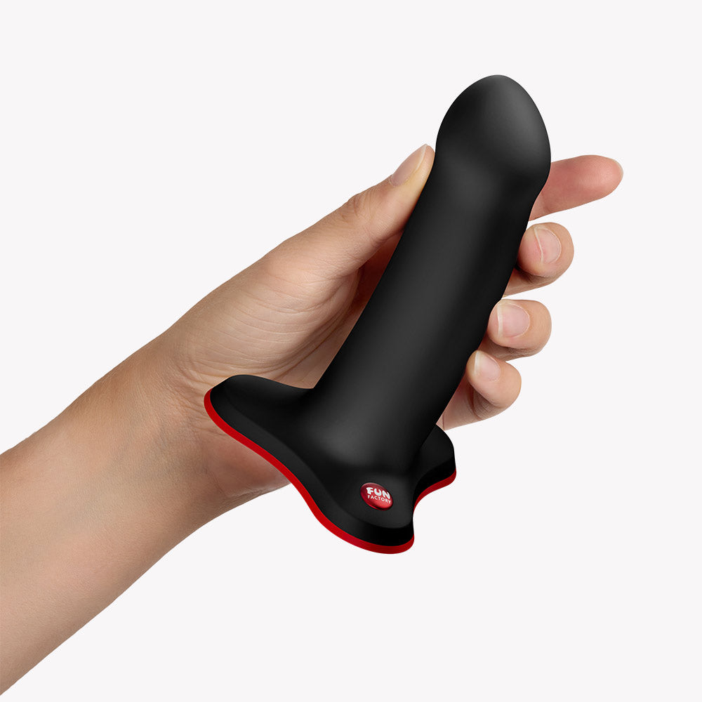 Fun Factory Amor G-Spot Dildo Black held in hand, showcasing its ergonomic design for pleasure.
