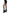 Leg Avenue Cracked Fishnet Tights One Size Black showcased with a leather dress and stylish boots.