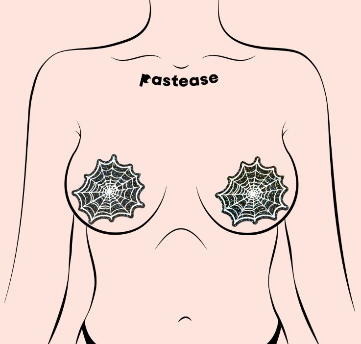 Pastease Glitter Black Glow In The Dark Spider Pasties displayed on a nude model's chest, showcasing spider web design.
