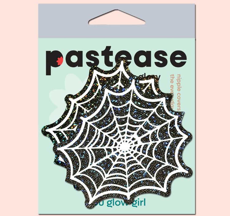 Pastease Glitter Black Glow In The Dark Spider Pasties in spider web shape on packaging, perfect for Halloween costumes.